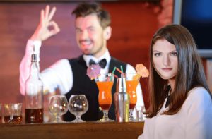 Annalyn Frame at a bar with the OK bartender